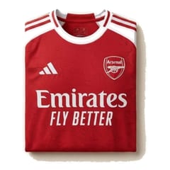Arsenal 2025/26 home jerseys hanging in a dressing room.