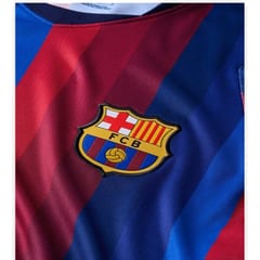 Barcelona 2026/27 home jersey in deep blue and claret stripes with the FC Barcelona crest.