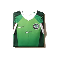Nigeria Super Eagles 2026 home jersey in bright green with a dotted fade pattern and the Nigeria Football Federation crest.