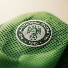 Nigeria Super Eagles 2026 home jersey in bright green with a dotted fade pattern and the Nigeria Football Federation crest.