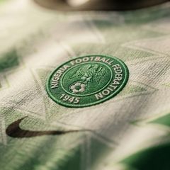 Nigeria Super Eagles retro jersey in white and green with a zigzag pattern across the body.